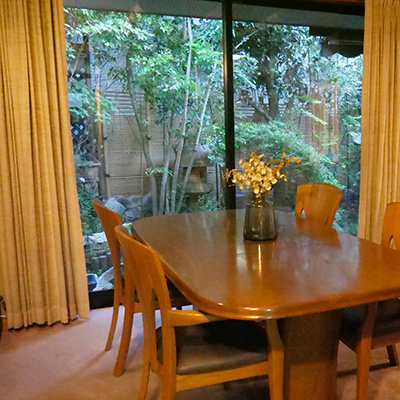 Living and dining room downstairs facing Japanese-style rock garden.